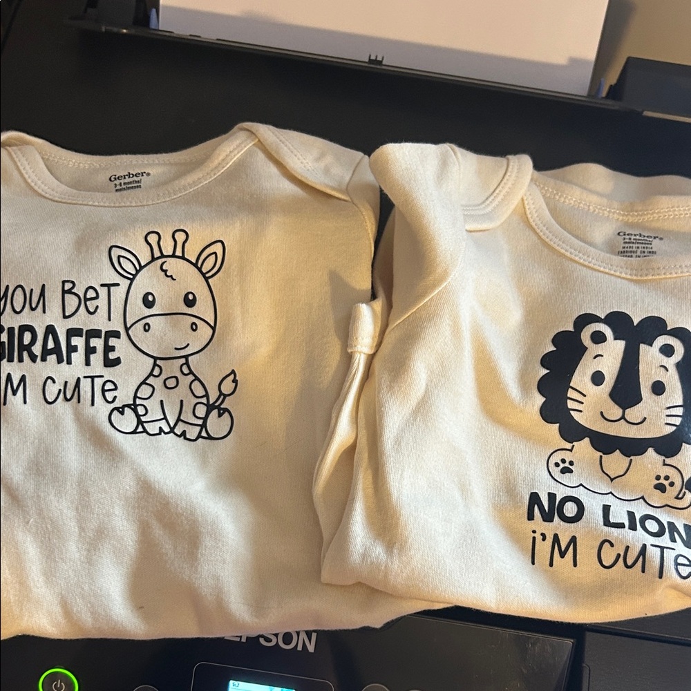 Gerber Cream Baby Onesies with Giraffe and Lion Prints